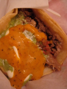 super carne asada taco with the best orange sauce on the planet